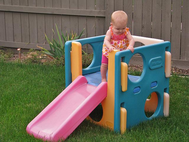 She got herself up there by crawling up the slide.