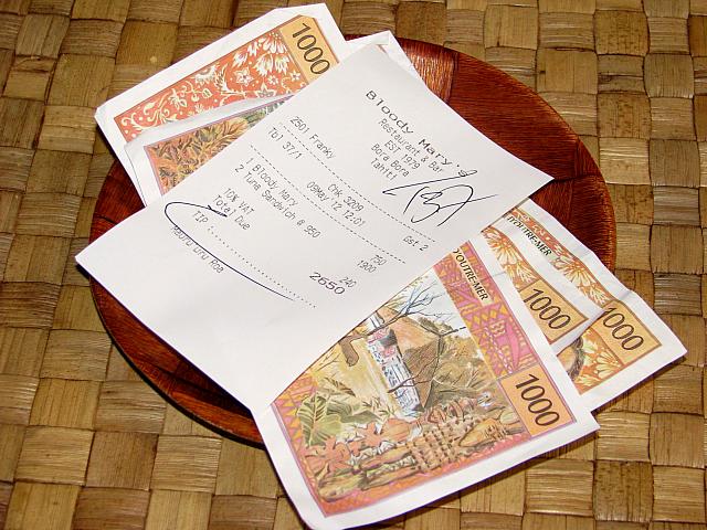 Paying the bill for lunch with local currency