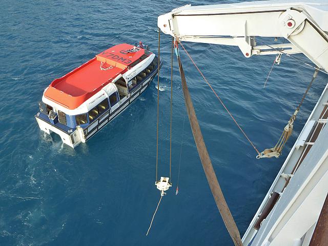 Tender prepares to be loaded (photo from our veranda)