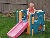 She got herself up there by crawling up the slide.