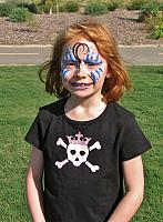Butterfly face paint at neighborhood boy's birthday party