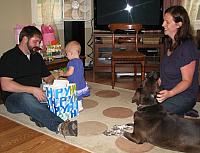 Left click on photo. Then use 'next' and 'previous' arrows to scroll through album.