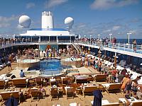 'Pollywogs' (those who have not previously crossed the Equator) wait in line to kiss the fish and bow before King Neptune, thus becoming "Shellbacks"