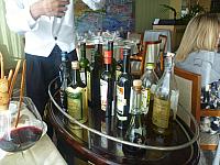 Cart with olive oils and balsamic vinegars in Toscana