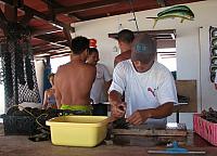 Opening the oyster far enough to put in a 'wedge'